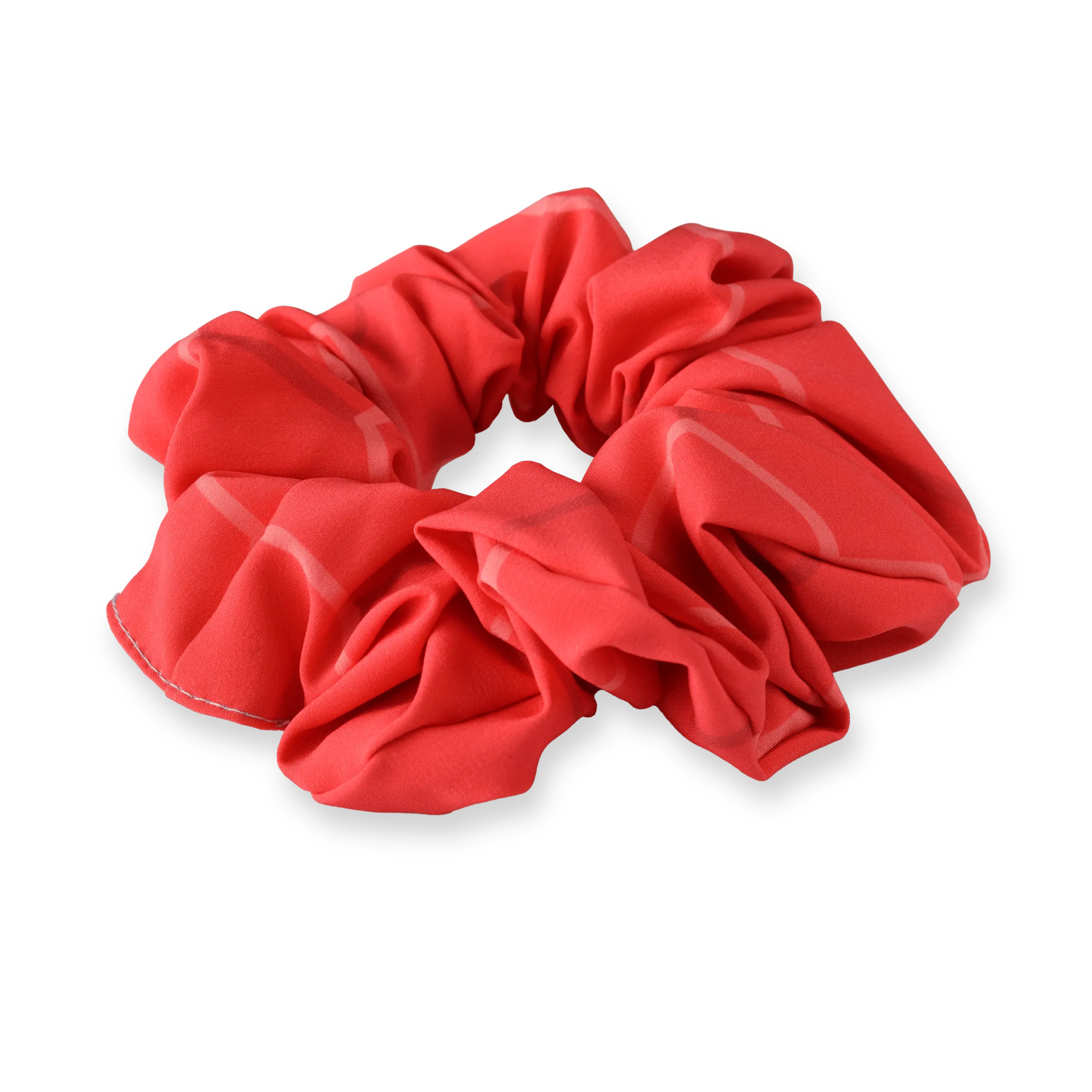 Un chouchou rouge en matériau doux avec un design décontracté.